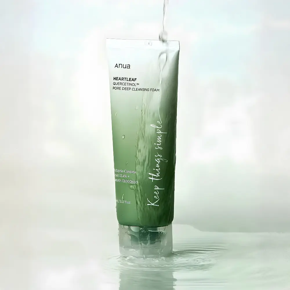 Anua Heartleaf Quercetinol Pore Deep Cleansing Foam 150ml 2 Anua Heartleaf Quercetinol Pore Deep Cleansing Foam 150ml tube standing in clean splashing water.