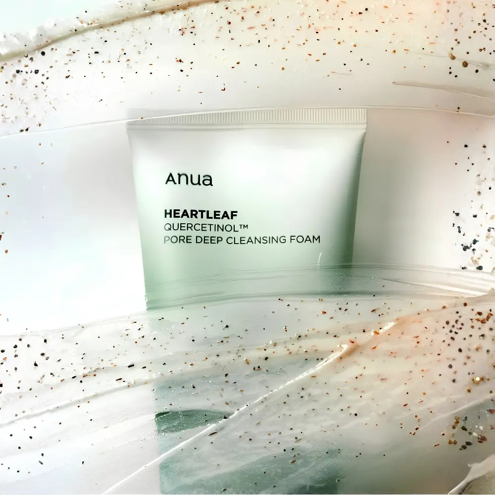 Anua Heartleaf Quercetinol Pore Deep Cleansing Foam 150ml 3 Cream texture close up with fine exfoliating particles from Anua Heartleaf deep cleansing foam.